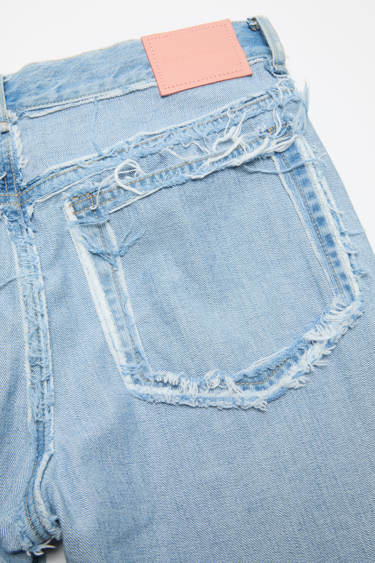Frayed Light Blue Denim Jeans